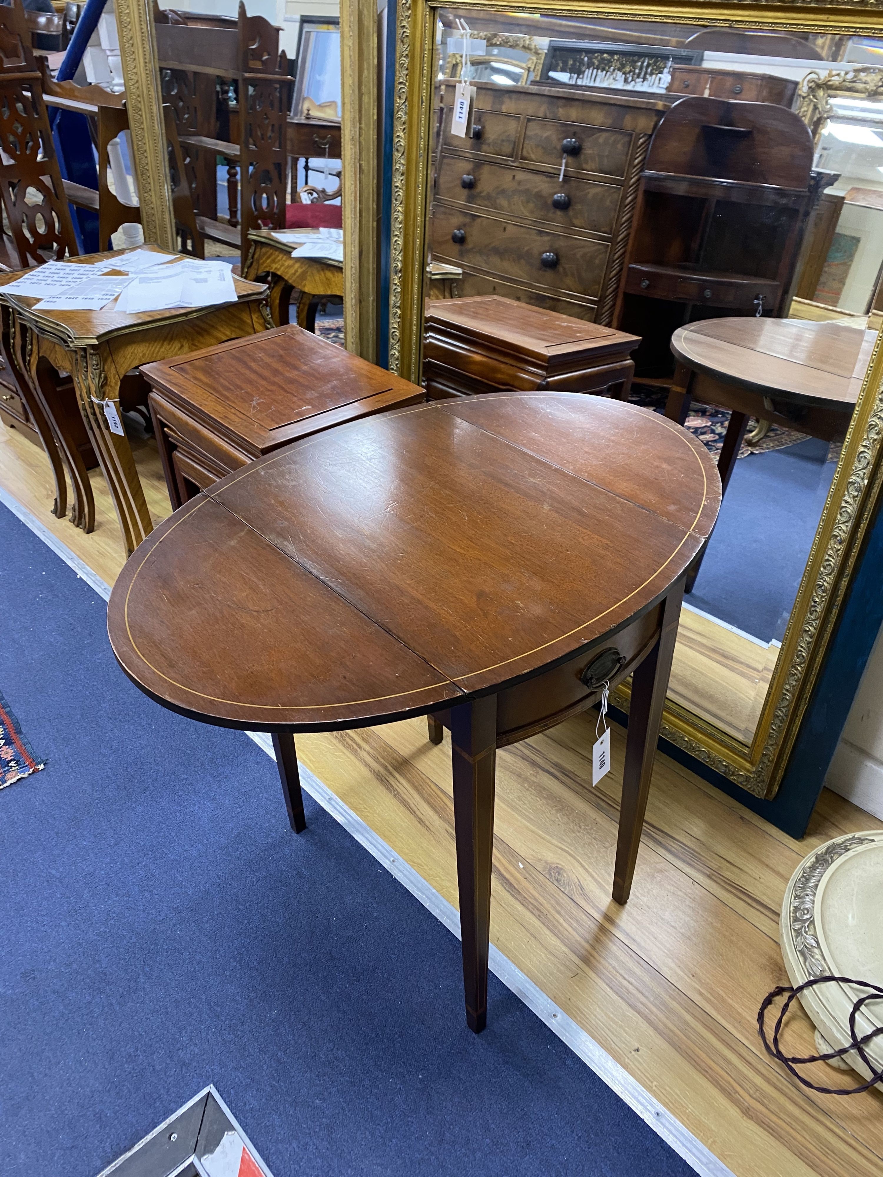 A small inlaid mahogany oval Pembroke table, width 52cm, depth 37cm, height 64cm